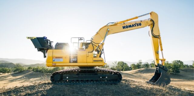 a yellow excavator sitting on top of a dirt field - A side profile of a trenching robot. The Exosystem has been added to the back of this Komatsu excavator to add autonomous capabilities. , tags: und - unsplash